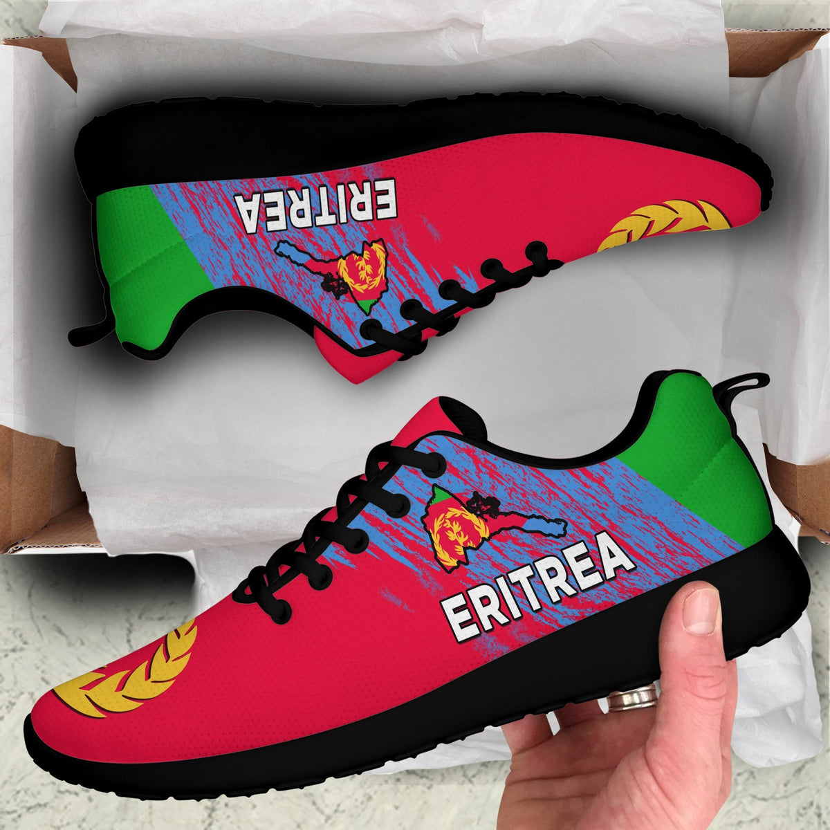 Red low-top Eritrea sneakers with black laces and green side panel, black sole