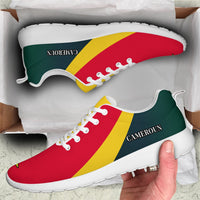 Cameroon-flag low sneakers in box, 'CAMEROUN' side text, green/red/yellow, white sole