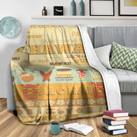 Yellow and orange Hawaii surf blanket with large “HAWAII” and “ALOHA” graphic, draped