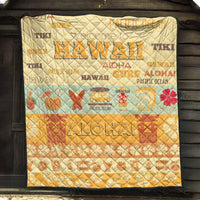 Quilt blanket with quilted diamond texture, yellow-beige base, surf and aloha graphics, black trim