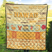 Quilt blanket with quilted diamond texture, yellow-beige base, surf and aloha graphics, black edge