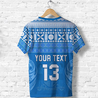 Blue T-shirt with white tapa pattern; 'YOUR TEXT 13' graphic shown on front