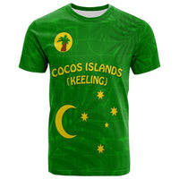 Green T-shirt front with 'COCOS ISLANDS (KEELING)' and yellow moon & stars
