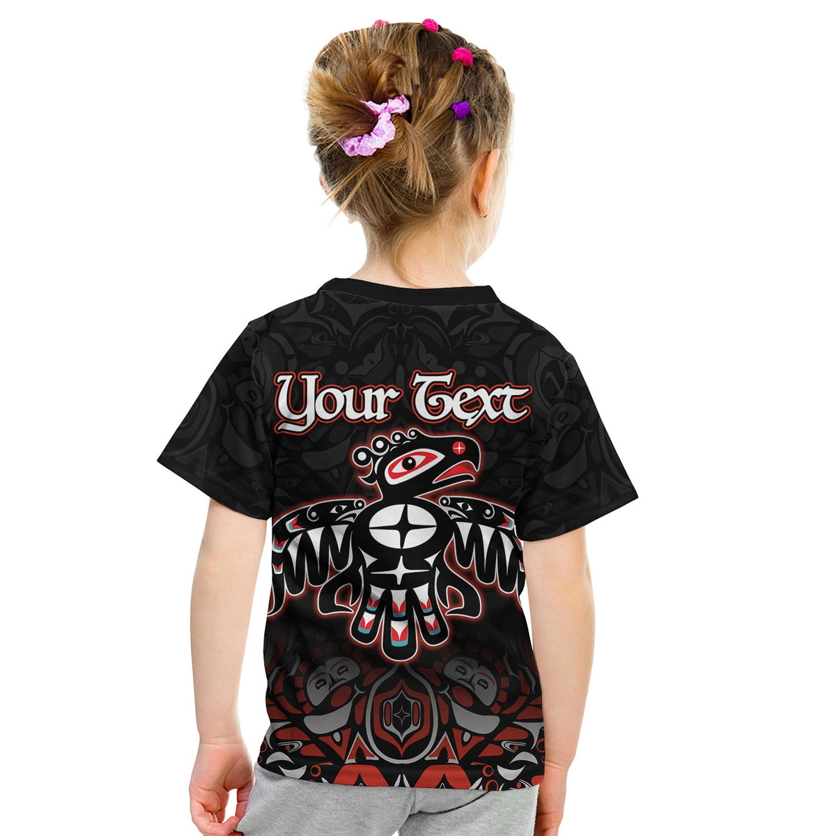 Kids black T-shirt back print with “Your Text” and Haida thunderbird design