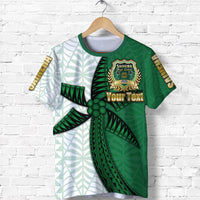 Green t-shirt with school crest and banner, leaf-and-ray side panel design