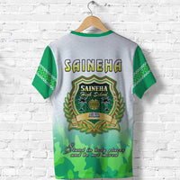 White T-shirt with green sleeves, Saineha back crest and slogan text, palm scene