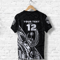 Black back of rugby T-shirt with large '12' and Polynesian face pattern