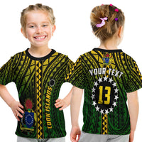 Kid T-shirt black with green Polynesian pattern; back star circle shows '13'.