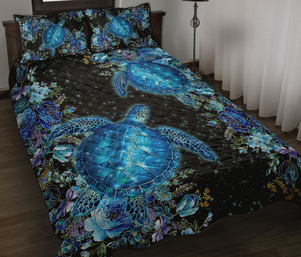 Blue turtle and flower quilt bed set with dark background, shown on a bed