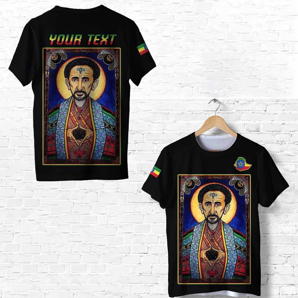 Black T-shirt with multicolor Haile Selassie portrait print and Ethiopian flag sleeve details