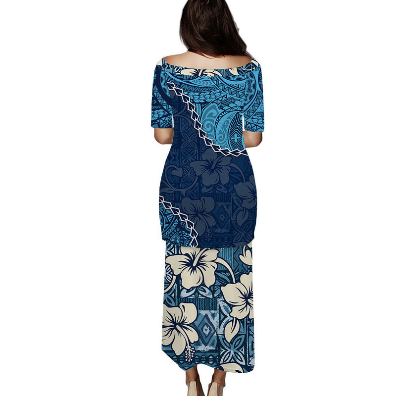 Blue long dress back view with 3/4 sleeves and tapa-style floral geometric print