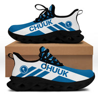 Angled white clunky sneakers with blue CHUUK print; thick black sole with tread cutouts