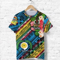Blue Torba T-shirt with colorful tropical print, flowers and tribal graphics—front