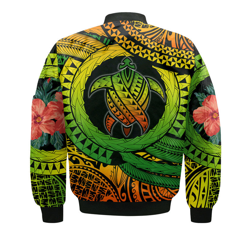 Bomber jacket back view with large turtle emblem and tropical foliage, black ribbed hem