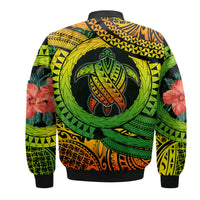 Bomber jacket back view with large turtle emblem and tropical foliage, black ribbed hem