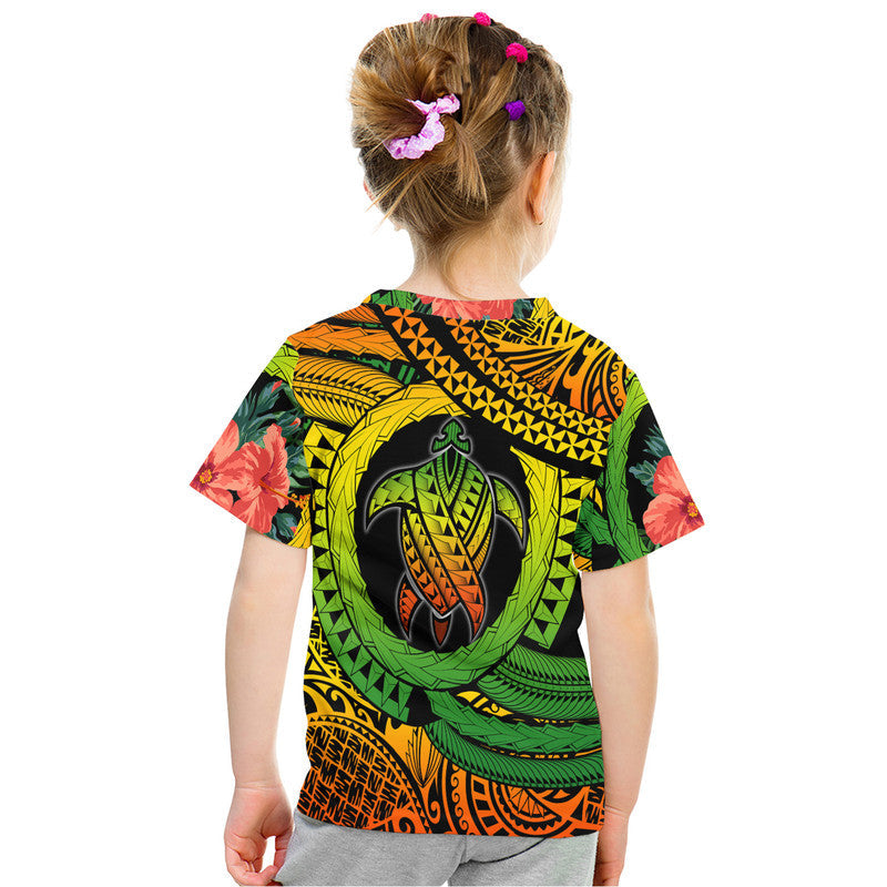 Kids turtle graphic T-shirt with back tribal motif, green yellow black orange flower