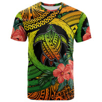 Kids turtle graphic T-shirt in green, yellow, black, and orange with flower accents