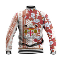 Back of white baseball jacket with red floral, tapa pattern hem and ribbed cuffs