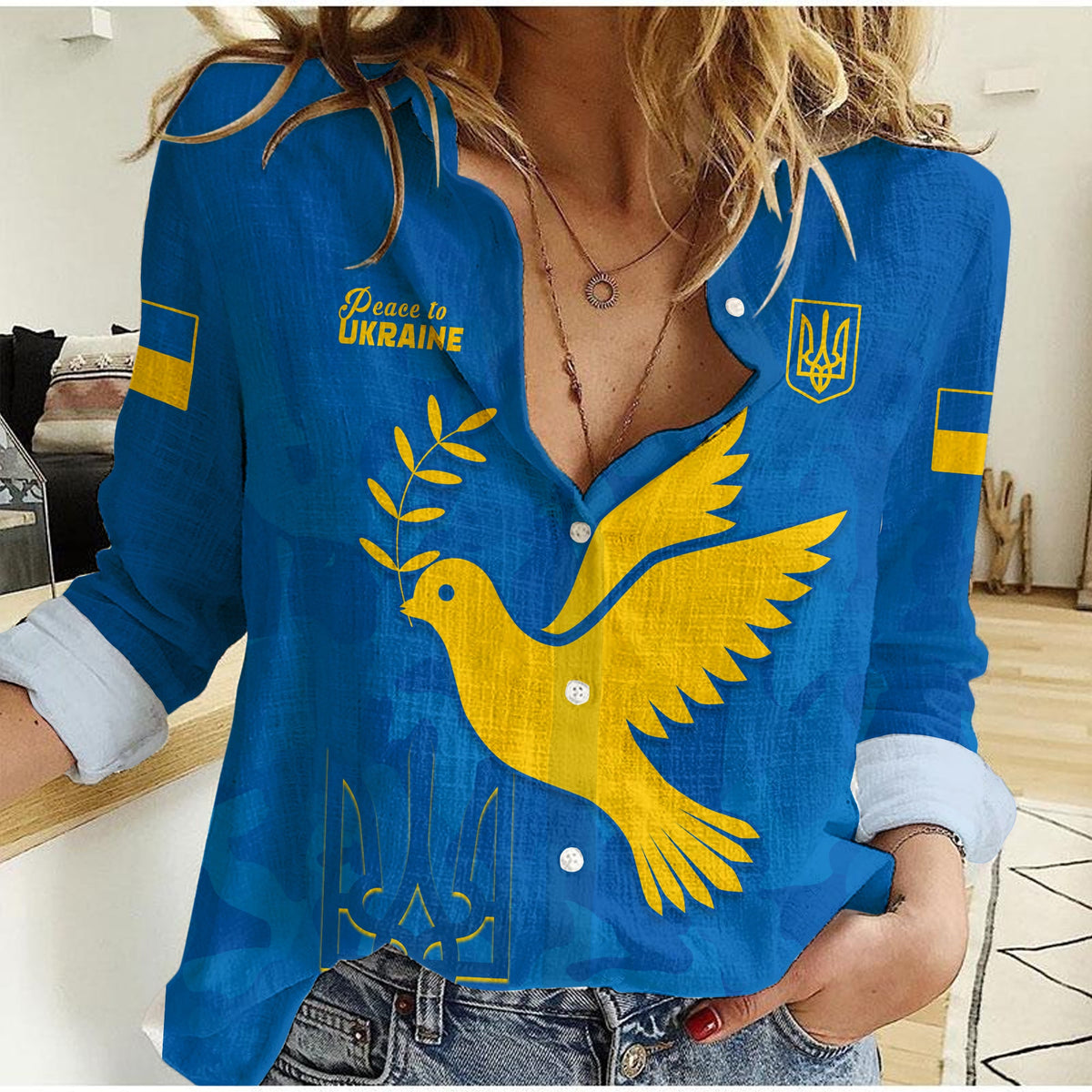 Women’s blue button-up shirt with yellow dove graphic and Peace to Ukraine text