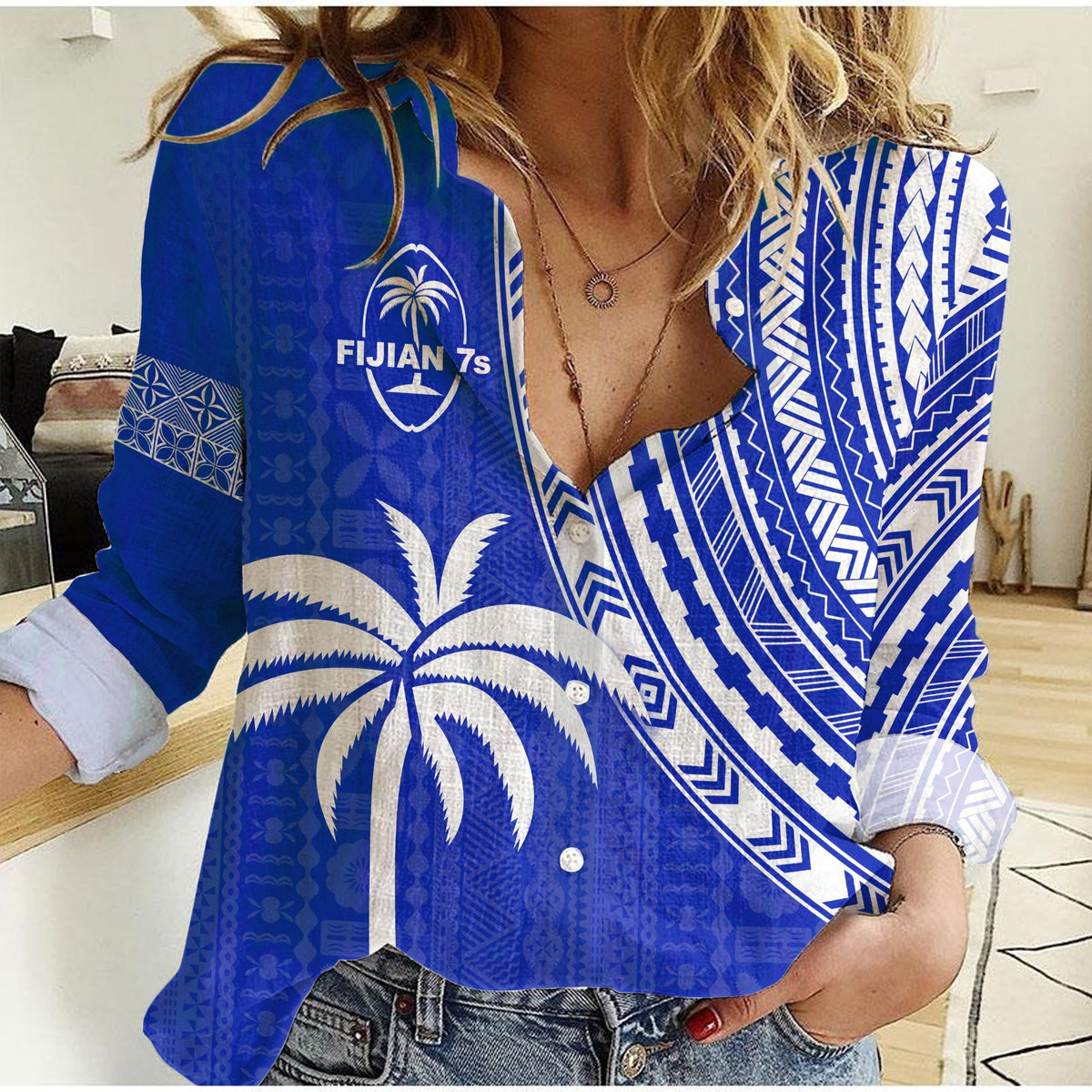 Women’s blue button-up shirt with white tapa pattern and palm graphic, long sleeves
