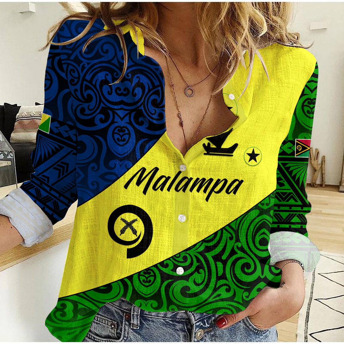 Yellow women’s casual button-up shirt with blue/green Vanuatu pattern and front text