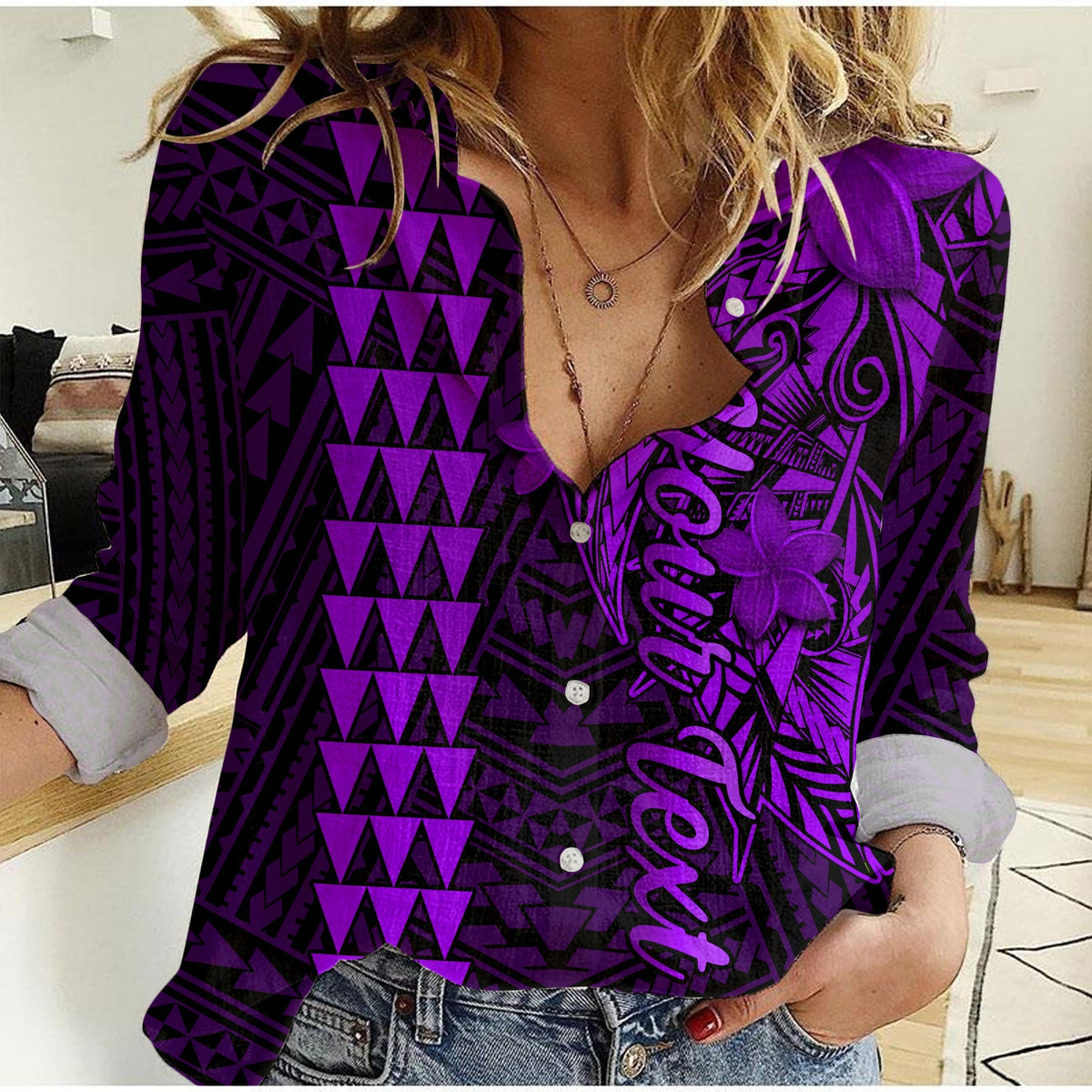 Purple women’s button-up casual shirt with geometric print and long sleeves.