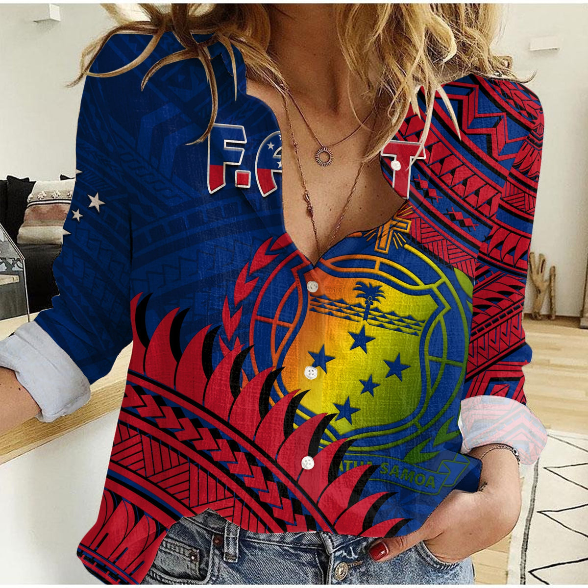 Women’s casual button-up shirt with Polynesian emblem pattern, blue, red, and yellow
