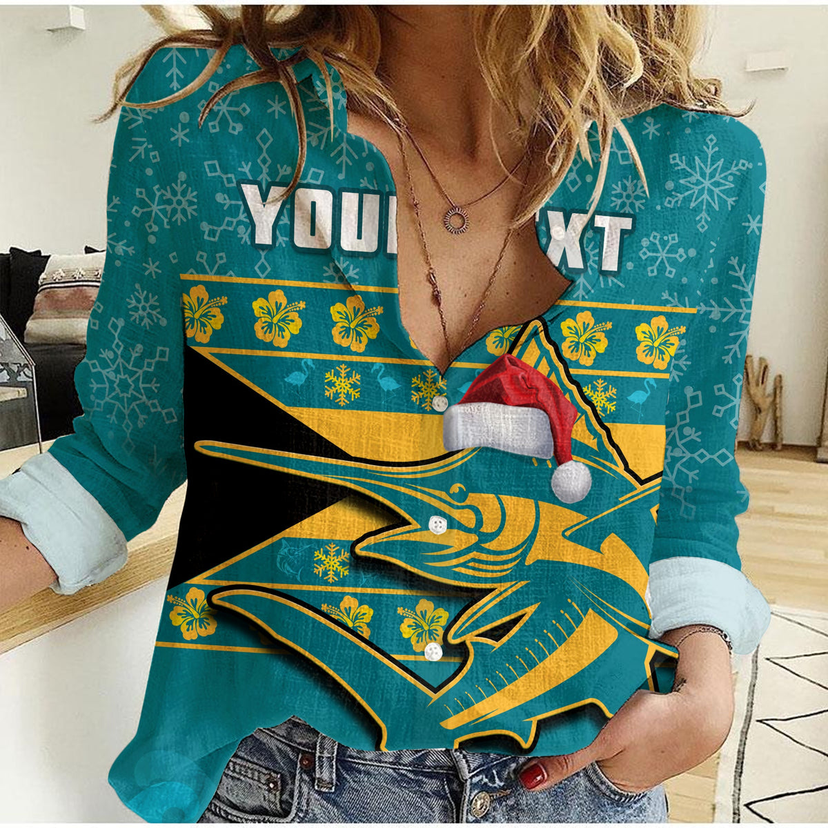 Women’s casual long-sleeve shirt in teal with starfish marlin Santa hat graphic