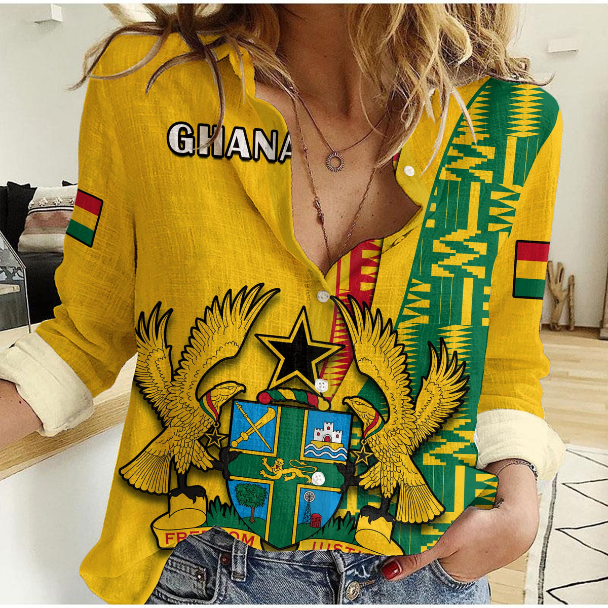 Yellow button-up casual shirt with green kente-style panel and crest print