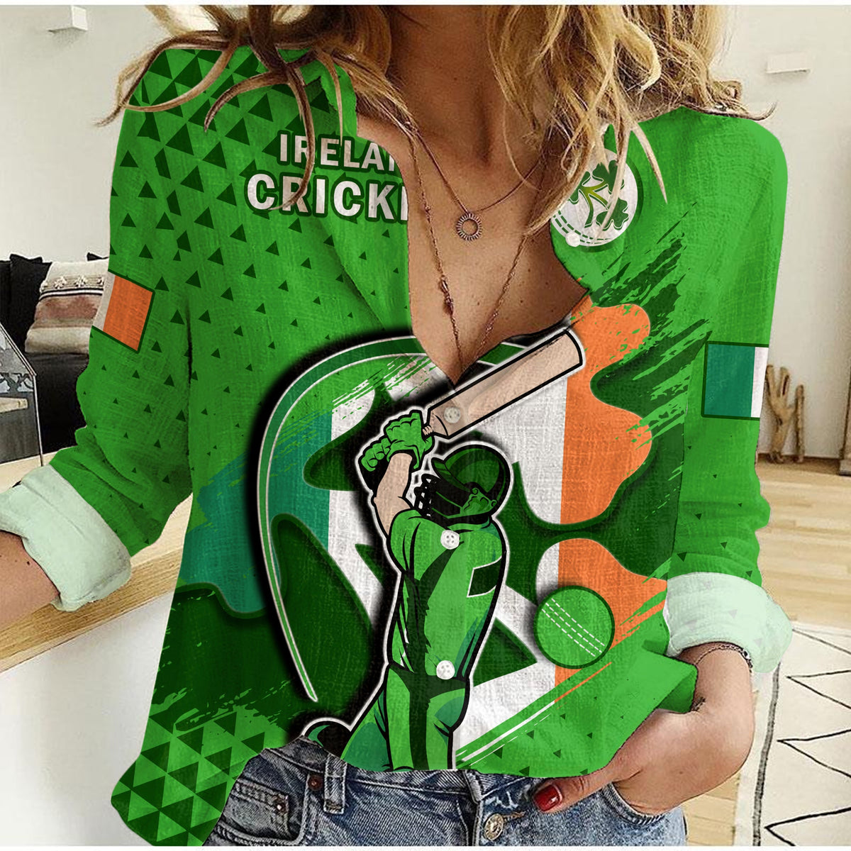 Green women’s cricket shirt with Irish flag print and shamrock emblem on chest
