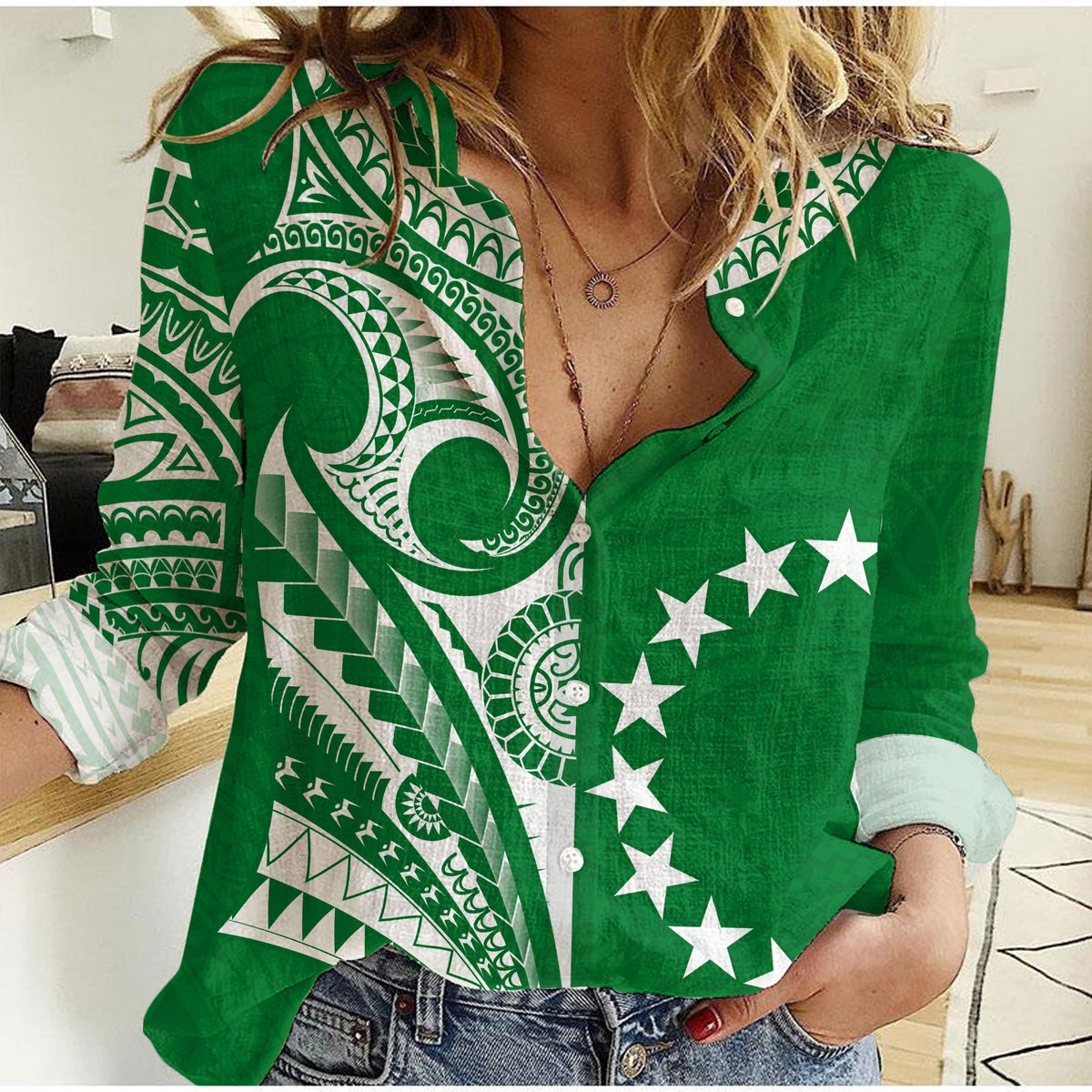 Green women’s button-up shirt with white tribal tattoo and star print
