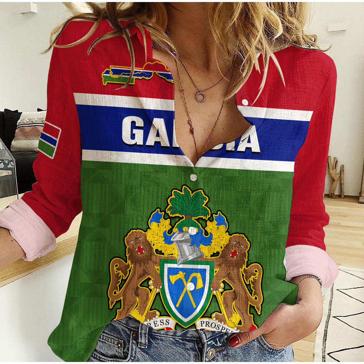 Women’s casual shirt in red, blue, and green with flag print, crest, and button placket