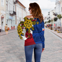 Women off-shoulder sweater, blue back with large yellow sun motif and red patterned lower