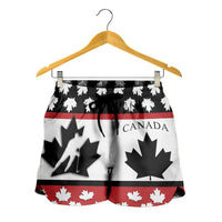 Hanging Canada women’s hockey shorts, white/red/black maple-leaf pattern, elastic waist