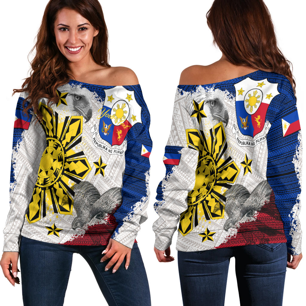 Off-shoulder sweater showing front and back eagle prints, white, blue, yellow, red accents