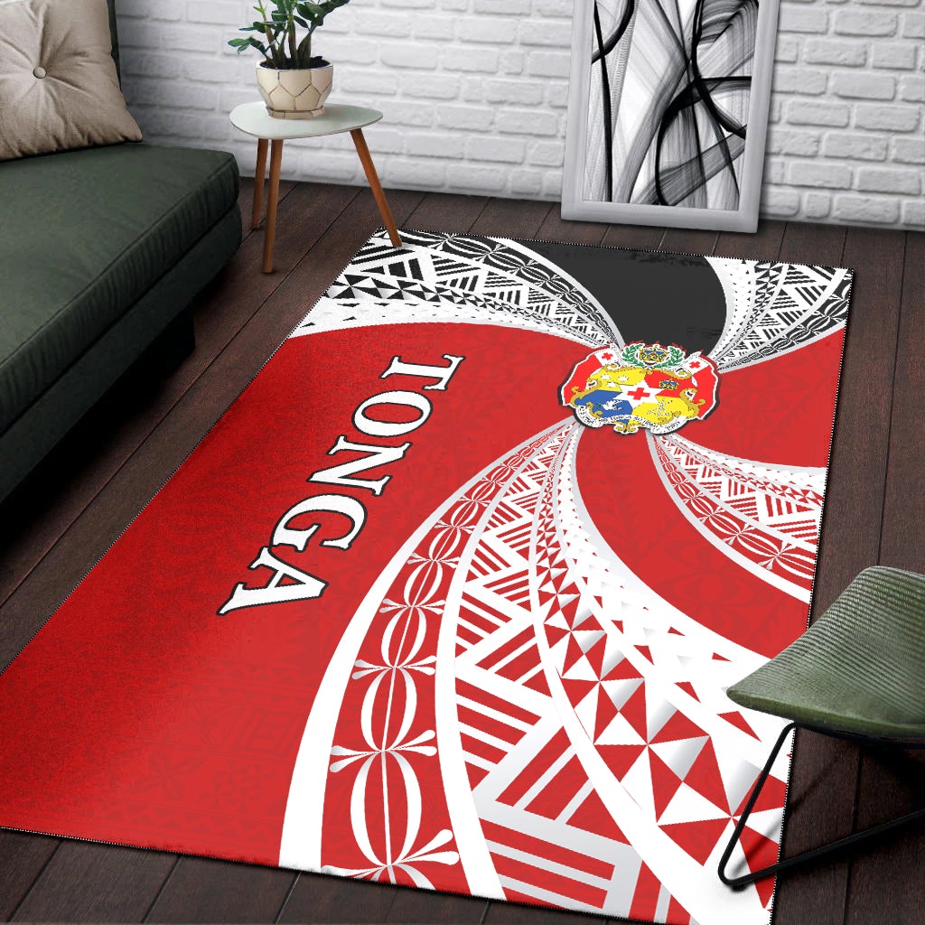 Red Tonga rug on wood floor: white crescent tapa design, 'Tonga' lettering, black border