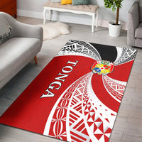 Red Tonga tapa rug with white graphic patterns and crest, black corner border