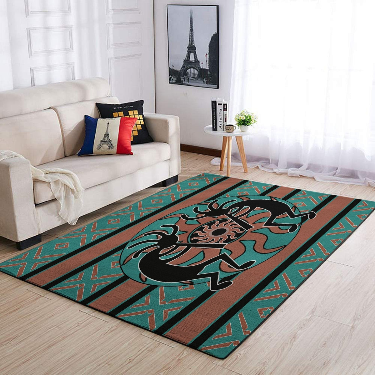 Teal Kokopelli rug with black figure, rust center panel, and red-green geometric border stripes