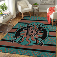 Teal and rust Kokopelli rug with black outline and geometric stripes along the perimeter