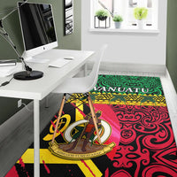 Vanuatu area rug with coat of arms medallion, green top and red swirling pattern