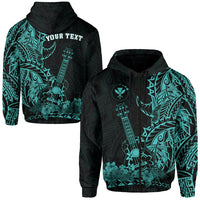 Turquoise zip hoodie with Polynesian guitar and floral print, black hood and front text