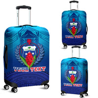 Blue luggage cover with crest graphic and 'YOUR TEXT' on rolling suitcase