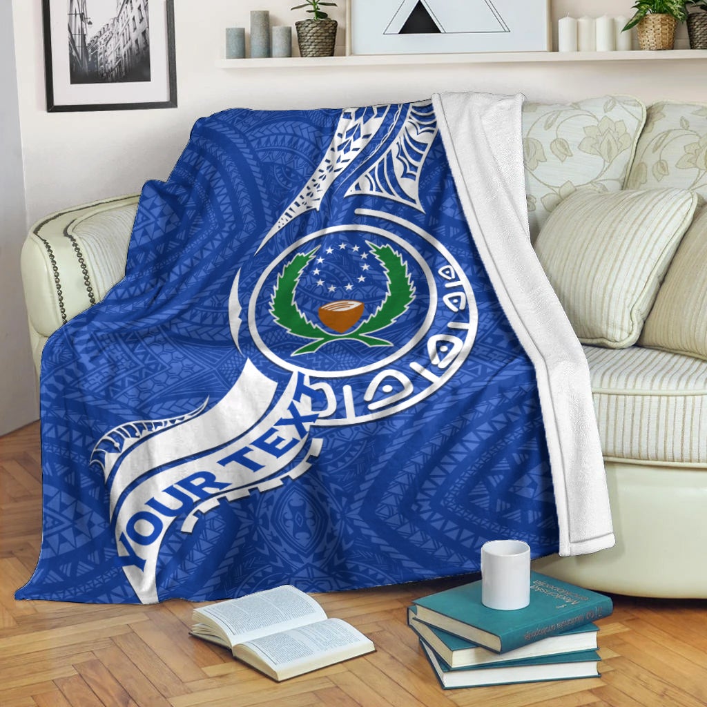 Pohnpei Pride blanket, blue with large circular crest and white tribal text border