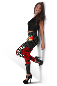 Red and black Tonga-style leggings with Polynesian print, angled view