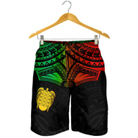 Men’s swim shorts on hanger, black with green and red tribal patterned waistband