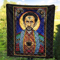 Black quilt with multicolor border, Haile Selassie portrait and cat faces in corners