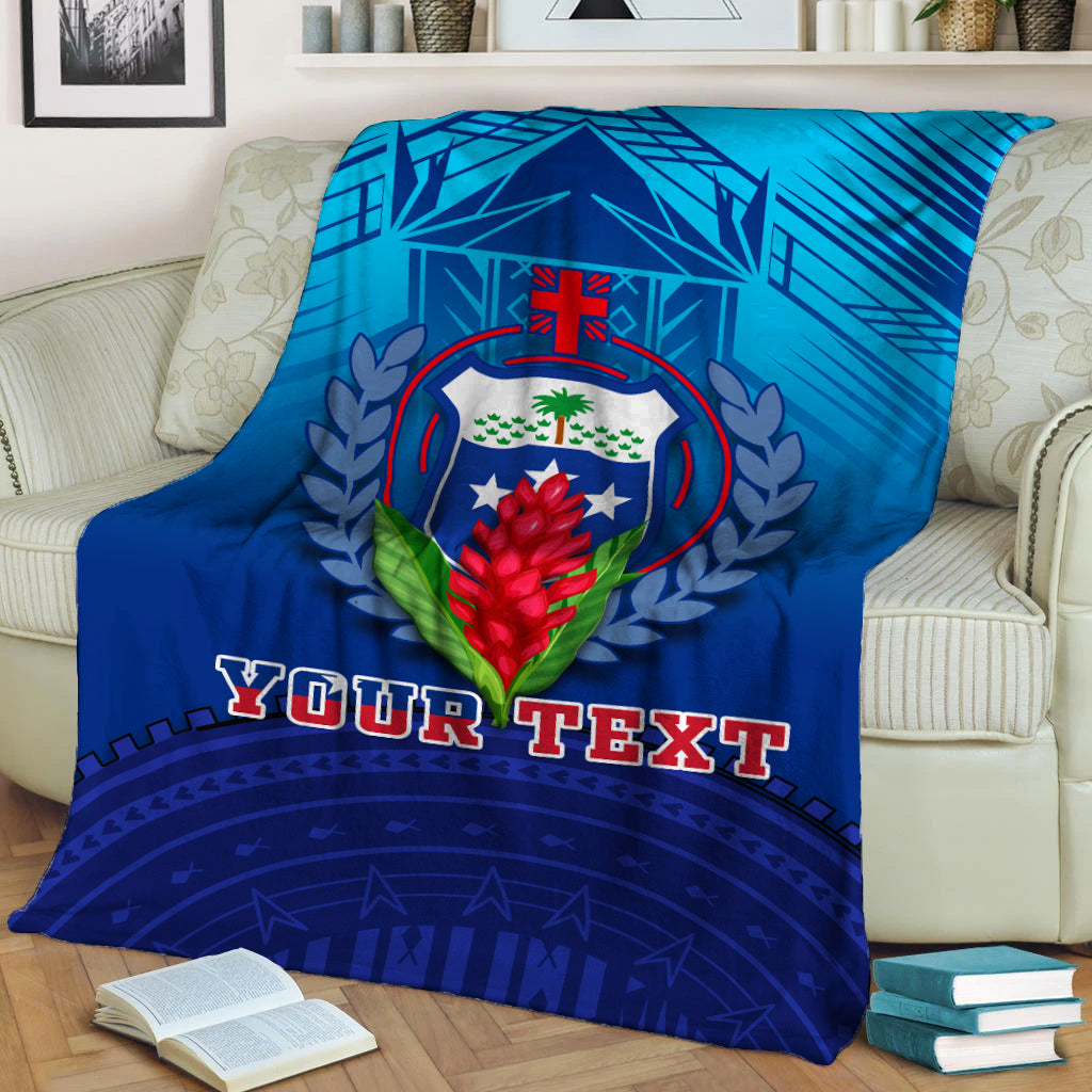 Blue throw blanket with central crest graphic and 'YOUR TEXT' printed across the front