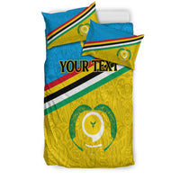 Juego edredón Vanuatu Torba azul con fundas, escudo verde central y franja multicolor