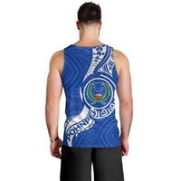 Back view of men’s blue tank top with large circular crest and patterned print