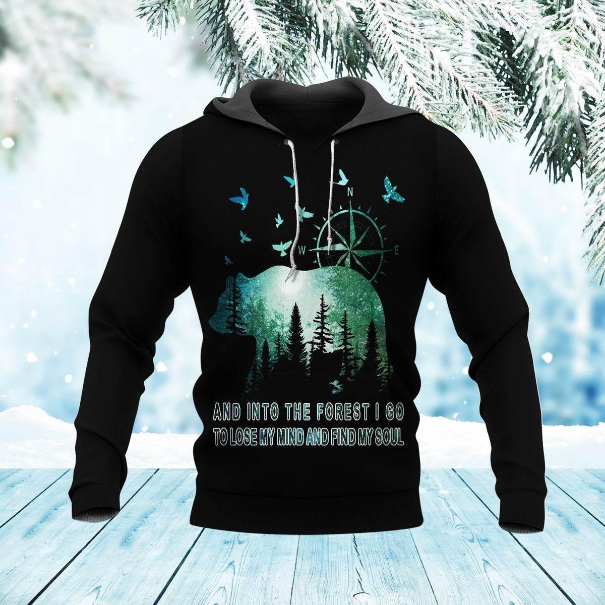 Black pullover hoodie with forest graphic, compass and birds on front